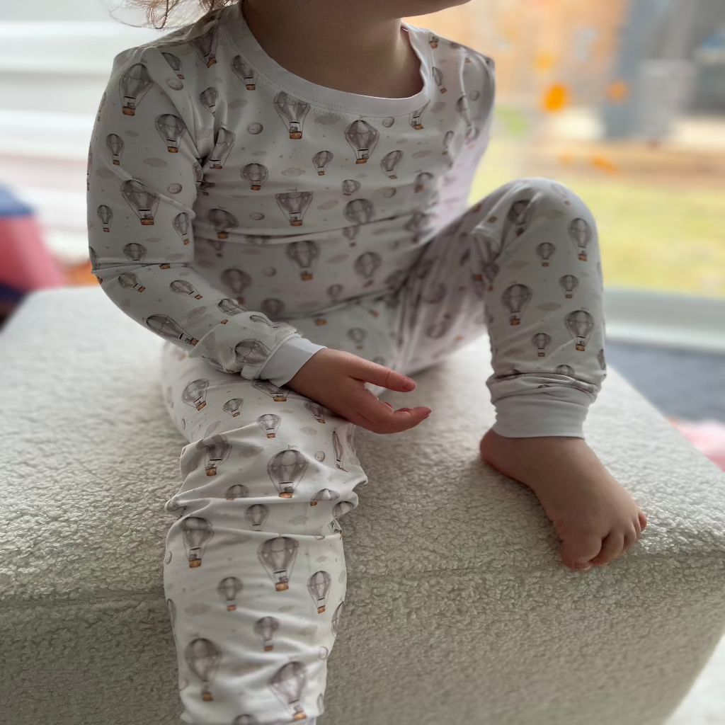 Hand-drawn hot air balloon and teddy bear print on ultra-soft bamboo pajama fabric.