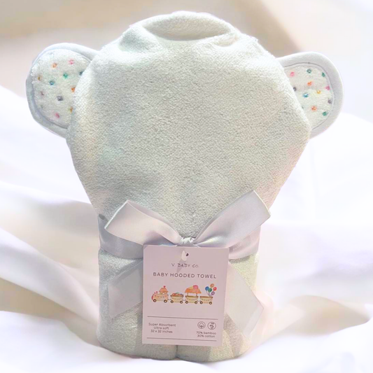 Soft hooded baby bath towel wrapped in a satin ribbon β perfect for newborns and toddlers.