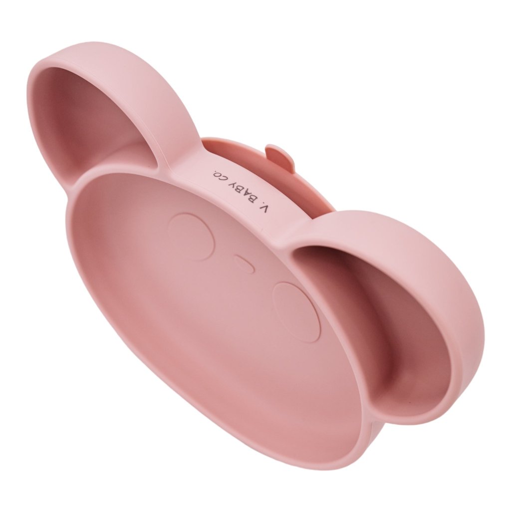 Secure suction base detail on silicone baby feeding plate for mess-free meals.